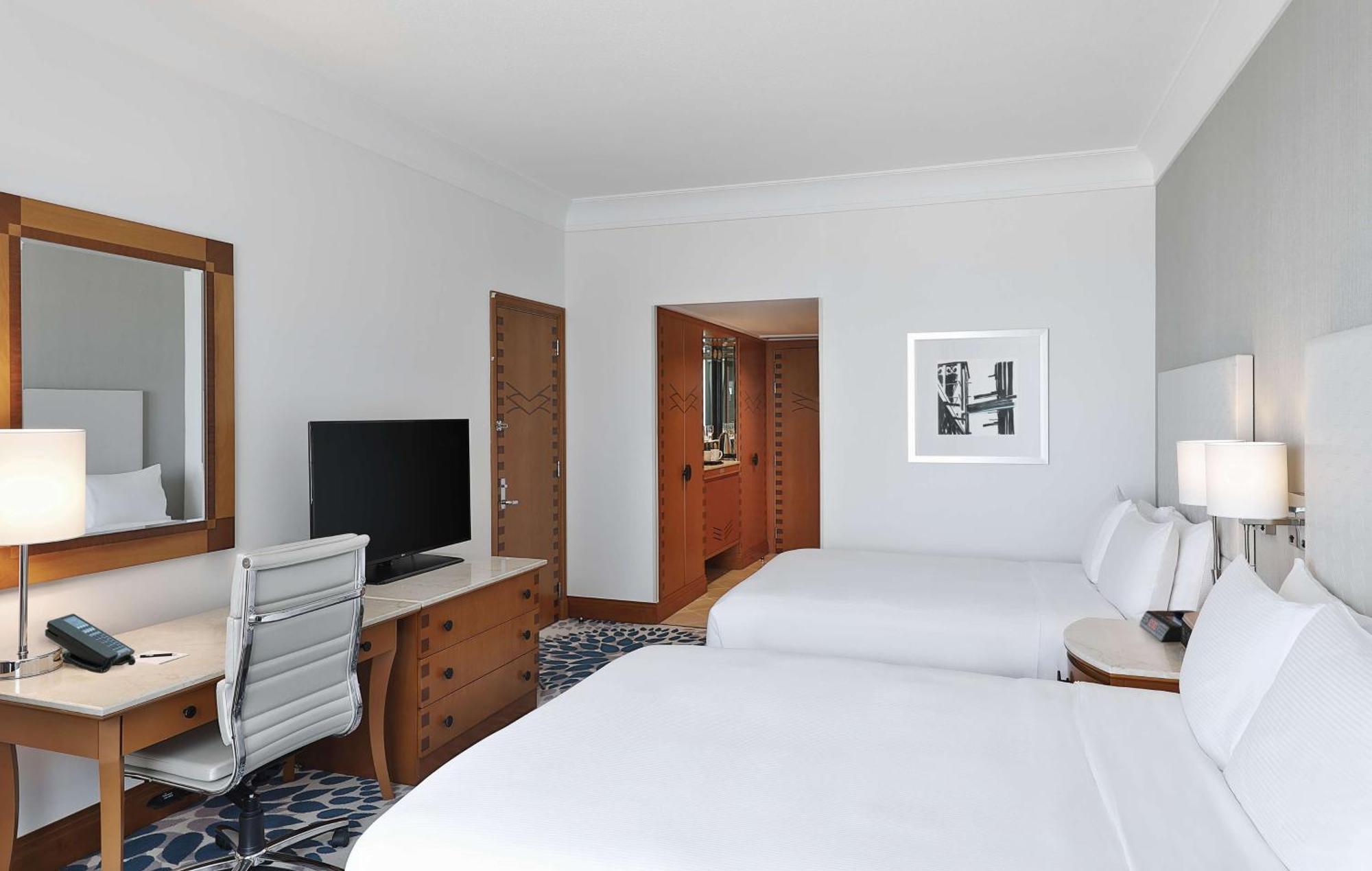 Deluxe Queen Room with Two Queen Beds and Partial Sea View